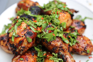 Spicy Thai Chicken Legs with garnish